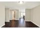 Hallway with access to bathroom and staircase, with hardwood flooring and neutral paint at 13797 E Southshore Dr, Fishers, IN 46037