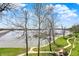 Beautiful lake view showing lakeside recreation area, dock, path and covered seating on a sunny day at 13797 E Southshore Dr, Fishers, IN 46037