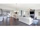 Spacious open concept living room featuring a kitchen, stylish furniture, and a fireplace at 13797 E Southshore Dr, Fishers, IN 46037
