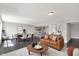 Inviting living room with an open-concept layout flowing into the kitchen and dining area at 13797 E Southshore Dr, Fishers, IN 46037