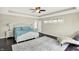 Bright primary bedroom featuring trey ceilings, hardwood flooring, and neutral paint at 13797 E Southshore Dr, Fishers, IN 46037