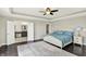 Primary bedroom with adjoining ensuite bathroom, neutral paint, and trey ceilings at 13797 E Southshore Dr, Fishers, IN 46037