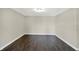 Empty room with neutral paint, hardwood floors, and a ceiling light at 13797 E Southshore Dr, Fishers, IN 46037