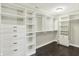 Organized walk-in closet featuring ample shelving, drawers, and hanging space at 13797 E Southshore Dr, Fishers, IN 46037