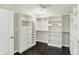 Large walk-in closet with custom shelving and storage drawers at 13797 E Southshore Dr, Fishers, IN 46037