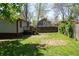 Fenced backyard with a small deck, offering a private outdoor space at 1410 E 75Th St, Indianapolis, IN 46240
