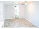 Bright bedroom with neutral walls, ceiling fan, and an open doorway to the bathroom, offering comfort and convenience at 1410 E 75Th St, Indianapolis, IN 46240
