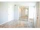 Spacious bedroom with a large mirrored closet, neutral walls, and ceiling fan, providing a relaxing and functional space at 1410 E 75Th St, Indianapolis, IN 46240