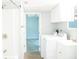 Convenient laundry area with washer, dryer, and sink, offering functionality and storage in a well-lit space at 1410 E 75Th St, Indianapolis, IN 46240