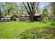 Spacious yard with a fence line, shade trees, and well-maintained lawn at 1410 E 75Th St, Indianapolis, IN 46240