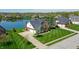 Beautiful brick home with well-manicured lawn and lake views at 14386 Salem E Dr, Carmel, IN 46033