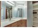 Bathroom with wood cabinets and white countertop offering a blend of warmth and brightness at 14386 Salem E Dr, Carmel, IN 46033