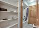 Bathroom featuring a shower and bathtub combo with a gray shower curtain and a storage shelf at 14386 Salem E Dr, Carmel, IN 46033