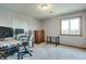 Bright bedroom featuring neutral walls, carpet flooring, and a desk set, offering an inviting and productive space at 14386 Salem E Dr, Carmel, IN 46033
