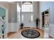 Grand foyer features a beautiful door, large window and wood floors at 14386 Salem E Dr, Carmel, IN 46033