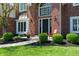 Beautiful brick home featuring manicured landscaping and a welcoming front entrance at 14386 Salem E Dr, Carmel, IN 46033