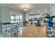 Open-concept kitchen and dining area with hardwood floors and a lake view, perfect for entertaining guests at 14386 Salem E Dr, Carmel, IN 46033