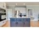 This spacious kitchen showcases a beautiful island with a granite countertop, perfect for meal preparation at 14386 Salem E Dr, Carmel, IN 46033
