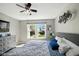 Relaxing bedroom with a ceiling fan, neutral color scheme, and plenty of natural light at 14429 Banister Dr, Noblesville, IN 46060