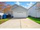 Spacious two-car garage with a concrete driveway and well-maintained lawn at 14429 Banister Dr, Noblesville, IN 46060