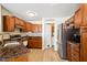 Cozy kitchen featuring wood cabinets, granite countertops, and stainless steel appliances at 14429 Banister Dr, Noblesville, IN 46060