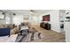 Inviting living room with modern decor, neutral colors, ceiling fan, and wood-look flooring at 14429 Banister Dr, Noblesville, IN 46060