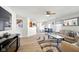 Open-concept living and dining area with stylish furnishings and wood-look flooring at 14429 Banister Dr, Noblesville, IN 46060