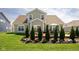 Beautiful home exterior with a well-maintained lawn and a patio area, perfect for outdoor relaxation and entertaining at 15142 Blue Ribbon Blvd, Fishers, IN 46040