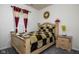 Inviting bedroom features a queen bed, bedside table, and warm decor at 15142 Blue Ribbon Blvd, Fishers, IN 46040