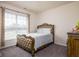 Relaxing bedroom with a comfortable bed, natural light, and neutral color tones at 15142 Blue Ribbon Blvd, Fishers, IN 46040