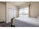 Cozy bedroom featuring a queen-sized bed, closet with sliding doors, and ample natural light at 15142 Blue Ribbon Blvd, Fishers, IN 46040