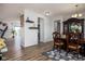 Open-concept dining area with hardwood flooring and elegant furnishings, creating a warm and inviting space at 15142 Blue Ribbon Blvd, Fishers, IN 46040