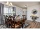 Elegant dining room featuring a large wooden table, stylish decor, and natural light, perfect for gatherings at 15142 Blue Ribbon Blvd, Fishers, IN 46040