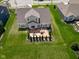 Aerial view of home with landscaped backyard and stamped concrete patio, fire pit, and dining area at 15142 Blue Ribbon Blvd, Fishers, IN 46040
