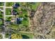 Birds eye view of residential home with a backyard, trees, lawn, and a nearby pond at 168 Yorkshire W Blvd, Cumberland, IN 46229