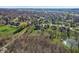 Scenic aerial view showcases homes nestled among mature trees in a well-established neighborhood at 168 Yorkshire W Blvd, Cumberland, IN 46229