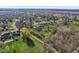 An elevated neighborhood view with mature trees and green spaces creating a serene residential setting at 168 Yorkshire W Blvd, Cumberland, IN 46229