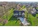 A high angle showcasing the backyard with an in-ground pool covered for the off-season at 168 Yorkshire W Blvd, Cumberland, IN 46229