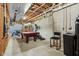 Unfinished basement featuring exposed ceiling, concrete walls, and exercise/recreation equipment at 168 Yorkshire W Blvd, Cumberland, IN 46229