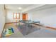 Finished basement with ping pong table, carpet and wood trim throughout the room at 168 Yorkshire W Blvd, Cumberland, IN 46229