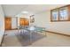 Finished basement with ping pong table, carpet and wood trim throughout the room at 168 Yorkshire W Blvd, Cumberland, IN 46229