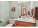 A well-kept half bathroom with bright walls and vanity cabinet in a cozy setting at 168 Yorkshire W Blvd, Cumberland, IN 46229