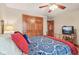 Comfortable bedroom with closet space, a ceiling fan, and classic bed frame at 168 Yorkshire W Blvd, Cumberland, IN 46229