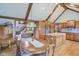 Open-concept kitchen and dining area features hardwood floors and a vaulted ceiling at 168 Yorkshire W Blvd, Cumberland, IN 46229