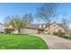 Spacious home with a well-manicured lawn, large driveway, and charming architectural details at 168 Yorkshire W Blvd, Cumberland, IN 46229