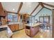 Bright kitchen features an island, wood cabinets, stainless steel appliances, and hardwood floors at 168 Yorkshire W Blvd, Cumberland, IN 46229