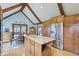 Bright kitchen features an island, wood cabinets, stainless steel appliances, and hardwood floors at 168 Yorkshire W Blvd, Cumberland, IN 46229