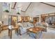 Open living area featuring vaulted ceilings, comfortable sofas, and hardwood flooring at 168 Yorkshire W Blvd, Cumberland, IN 46229
