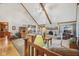 Living room with cathedral ceilings, a stone fireplace, and comfortable seating at 168 Yorkshire W Blvd, Cumberland, IN 46229