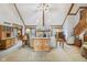Spacious living room featuring a stone fireplace, vaulted ceilings, and comfortable seating at 168 Yorkshire W Blvd, Cumberland, IN 46229